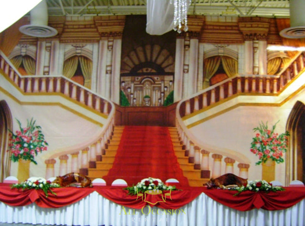 Elegant center pieces flower decoration on a beautiful event backdrop with grand staircase and floral arrangements.