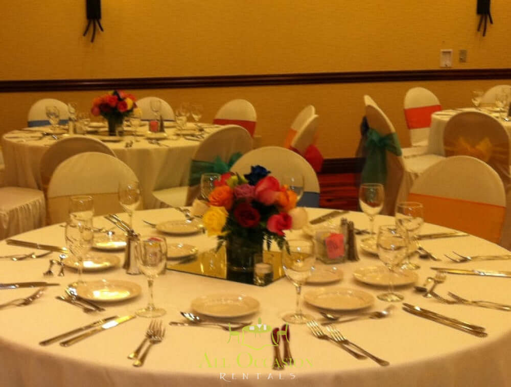 Event Centerpieces Flowers beautifully arranged on elegant dining tables for festive events and celebrations.