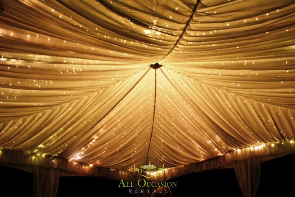 Elegant tent liners with twinkling lights, perfect for Corona event rentals and wedding decorations.