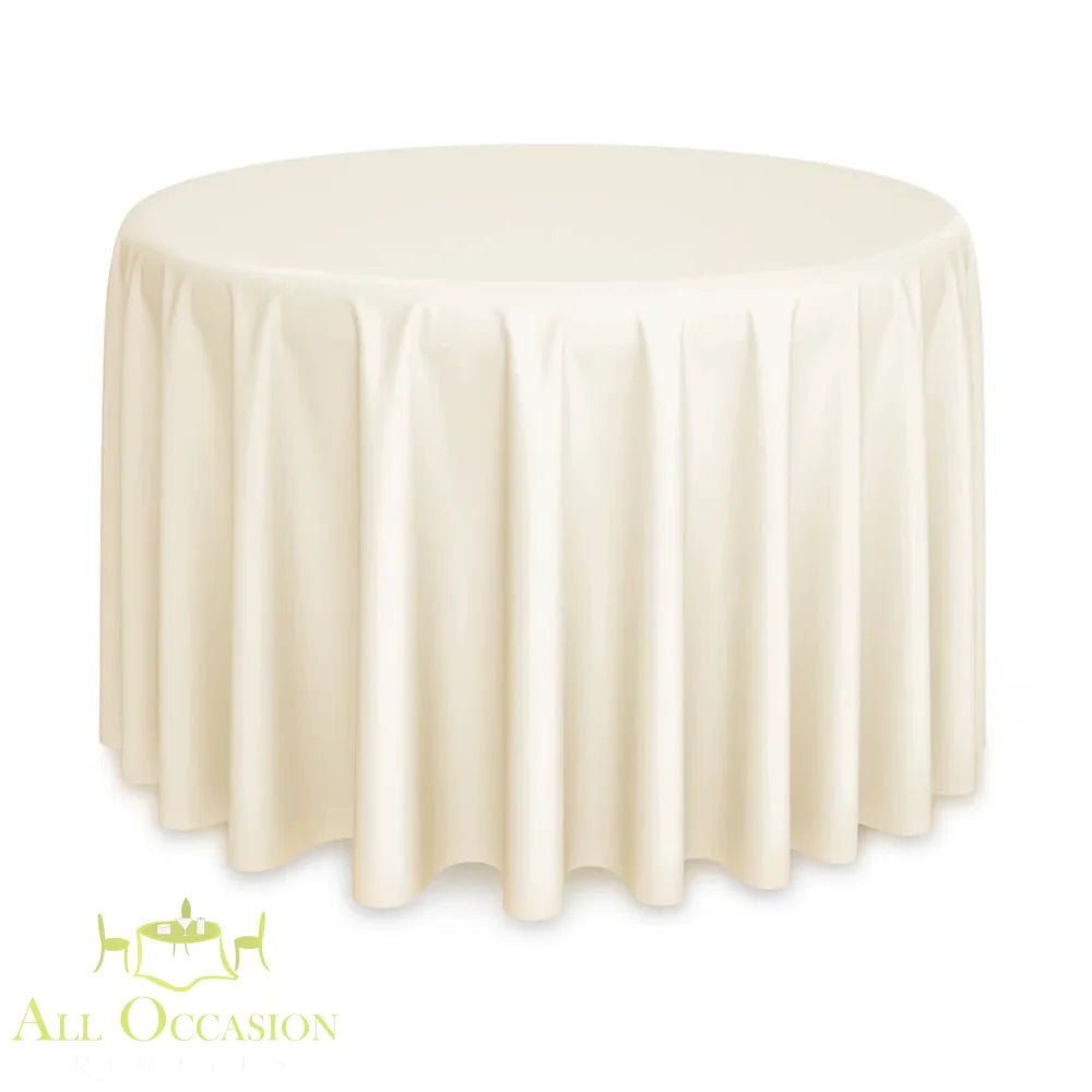 Ivory linen on a round event table showing round tablecloth size and drop