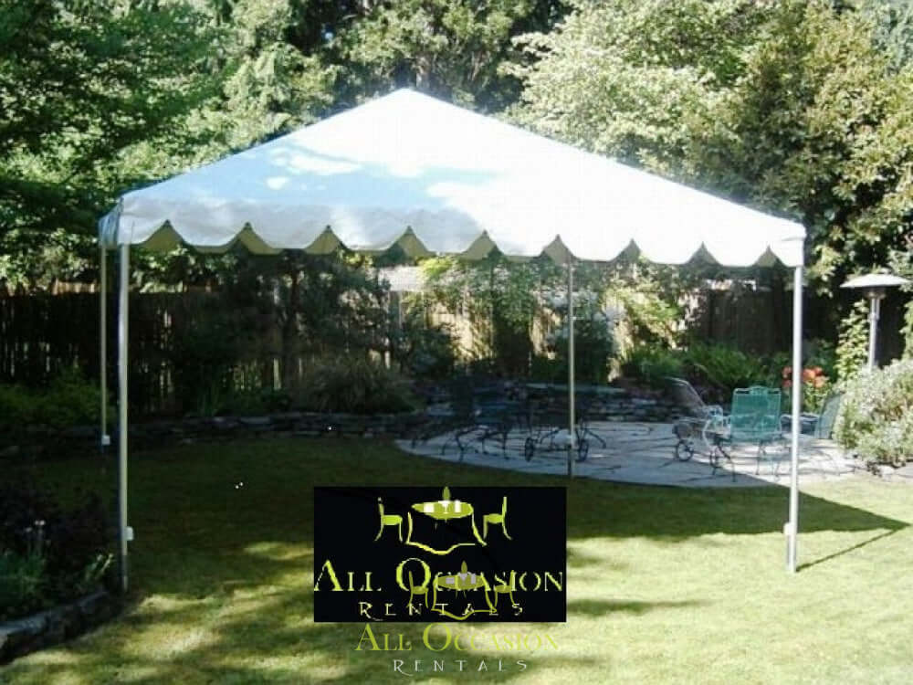 Tent rentals in Corona set up for an outdoor event in a garden with seating arrangements.