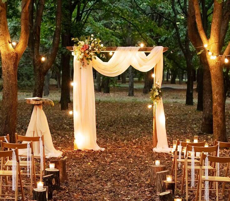 Beautiful outdoor wedding setup with draped fabric and lights, perfect for party rentals Temecula.