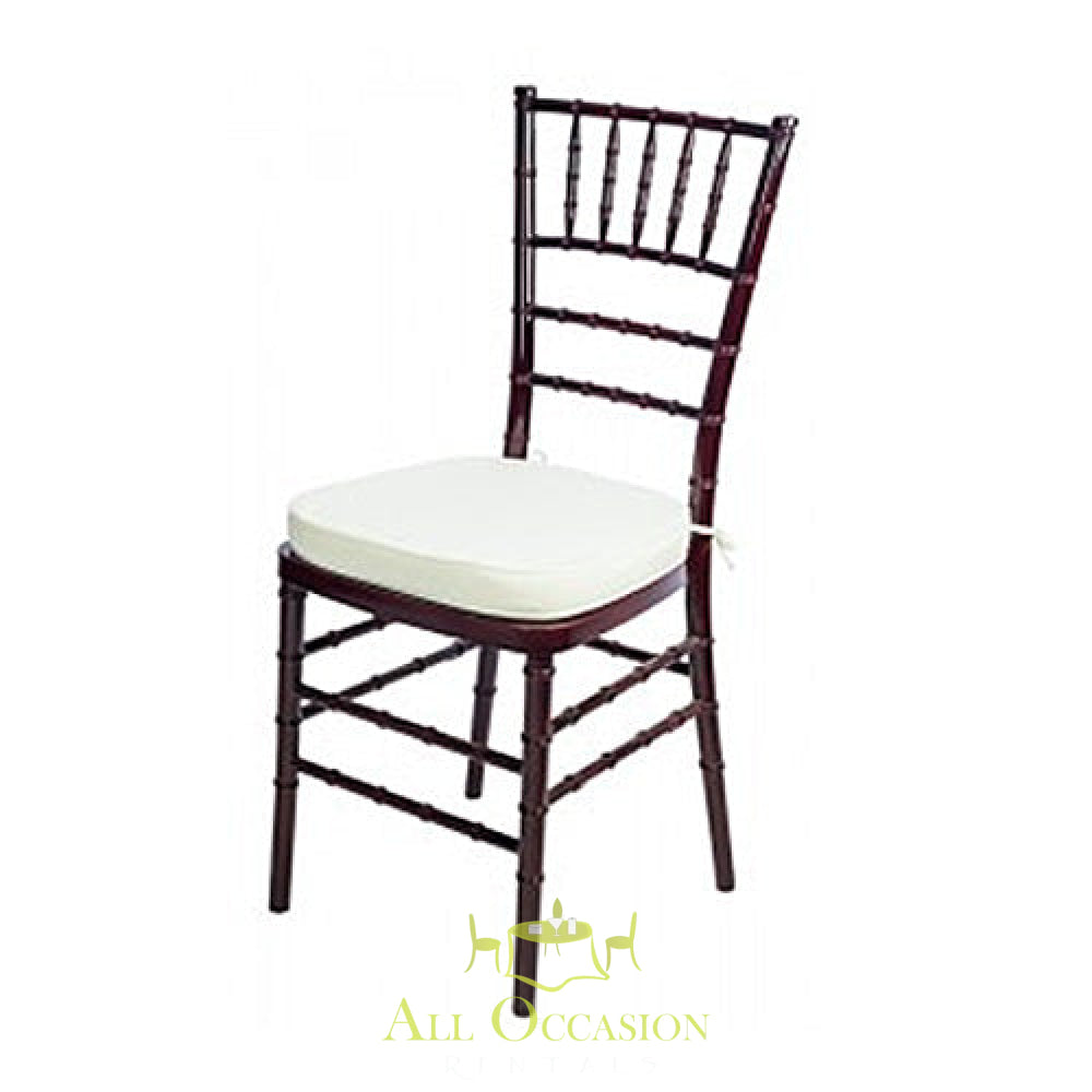Chiavari chair mahogany with ivory cushion for event rentals in Corona, ideal for weddings and special occasions.