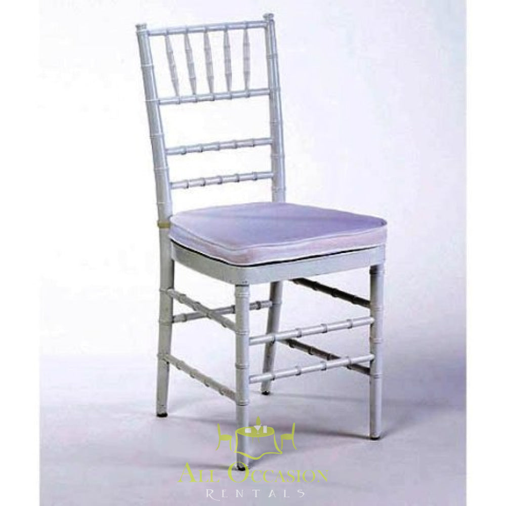 Chiavari chair in silver with white cushion, ideal for weddings and events. Available through Corona event rentals.