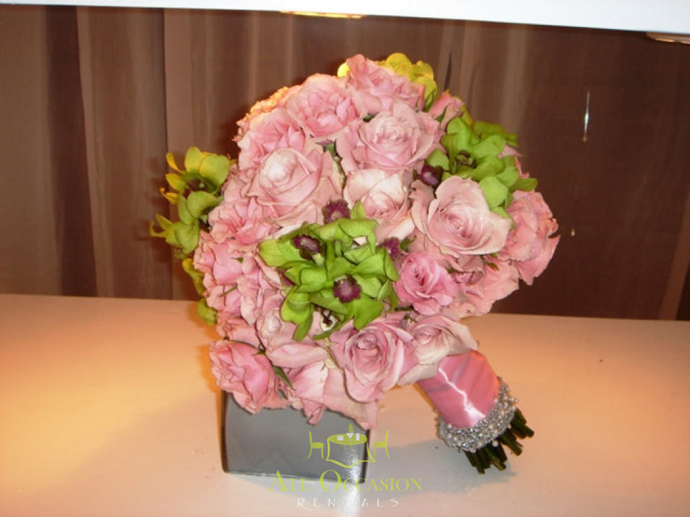 Elegant pink rose bouquet for weddings, available through Corona event rentals, perfect for bridal decor.