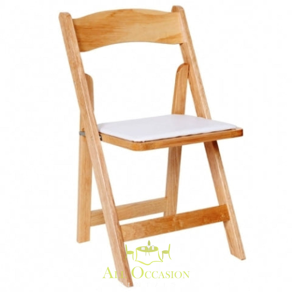 Wood natural folding chair with padded seat for event rentals in Corona, perfect for weddings and parties.