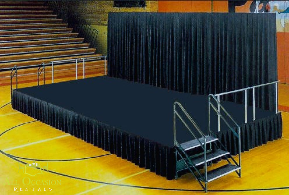 12' X 32' Stage Rental featuring a large platform with black drapes and steps for performances and events.