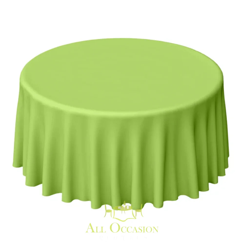 132 Inch Round Polyester Tablecloth Lime Green displayed on a round table, ideal for weddings and special occasions.