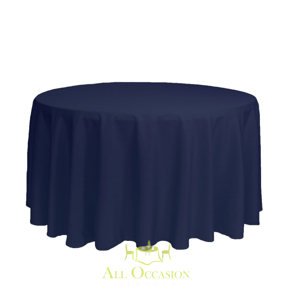 132 Inch Round Polyester Tablecloth Navy Blue displayed on a round table, perfect for elegant events and celebrations.