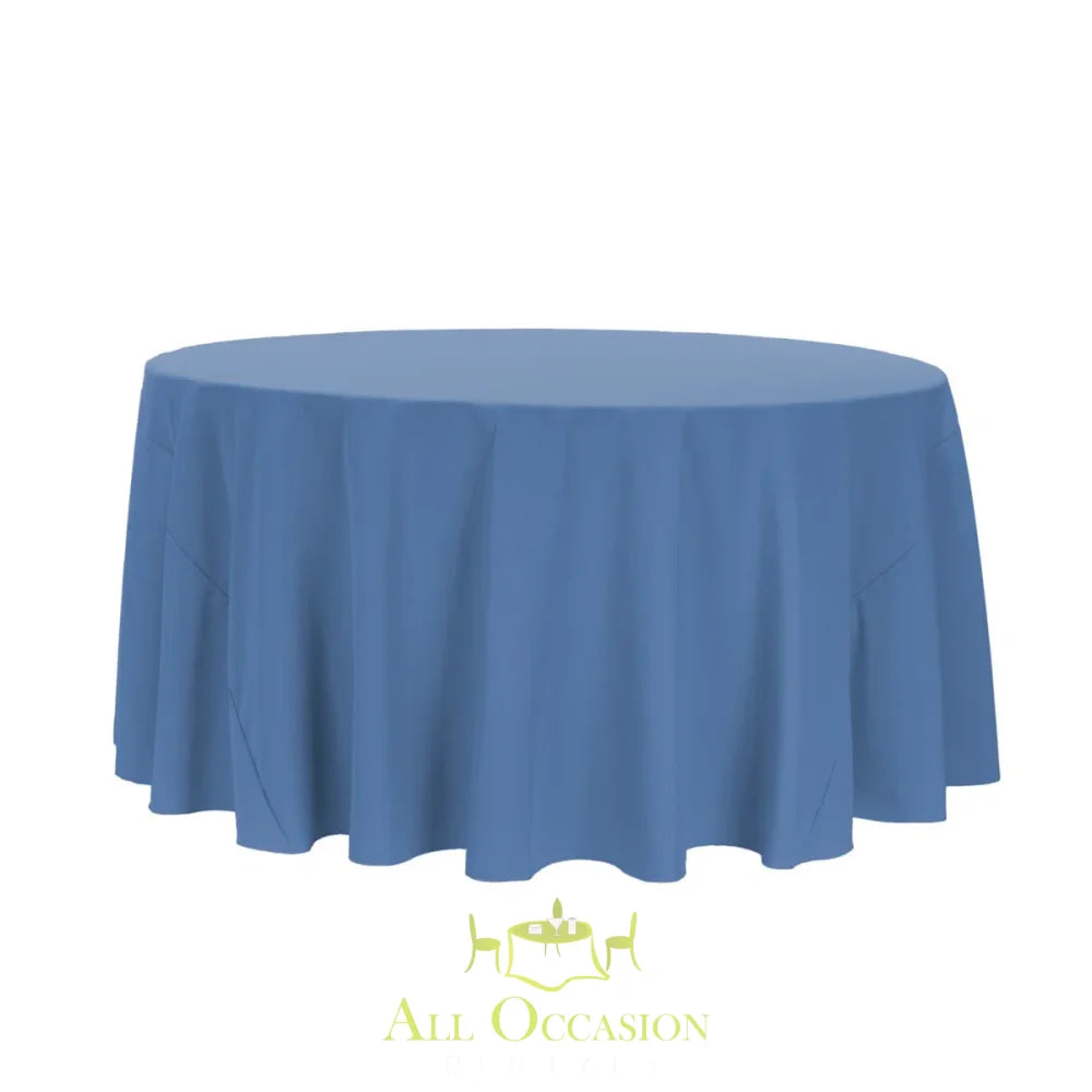 132 Inch Round Polyester Tablecloth Slate Blue draped over a round table for elegant event decor.