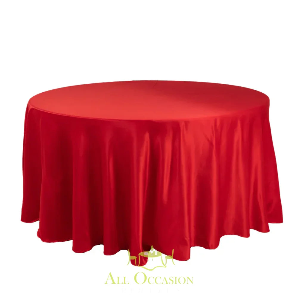 132 Inch Round Polyester Tablecloth Satin Red on a round table, perfect for weddings and elegant events.