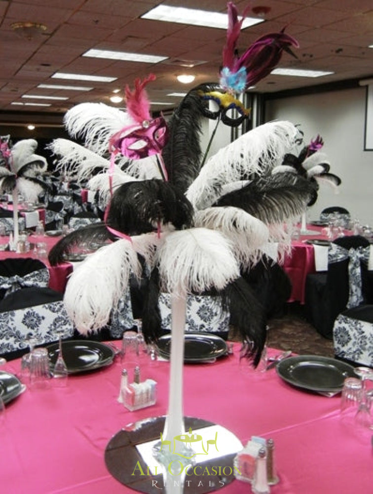Elegant feather centerpieces for event rentals in Corona, perfect for weddings and themed parties.