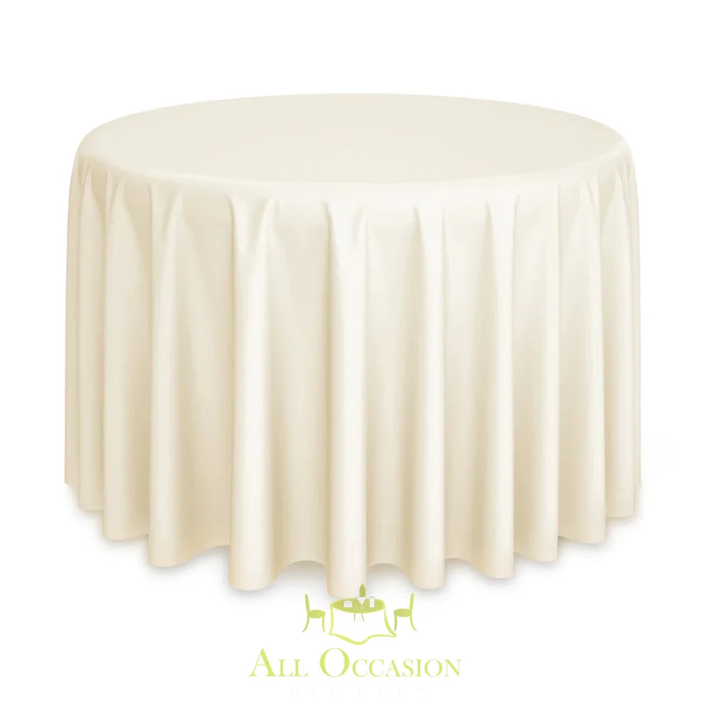 90 inch Round Polyester Tablecloth Ivory draped elegantly over a round table in a soft ivory color.