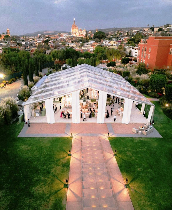 Large clear-span tent with city view showcasing brand authority and scale