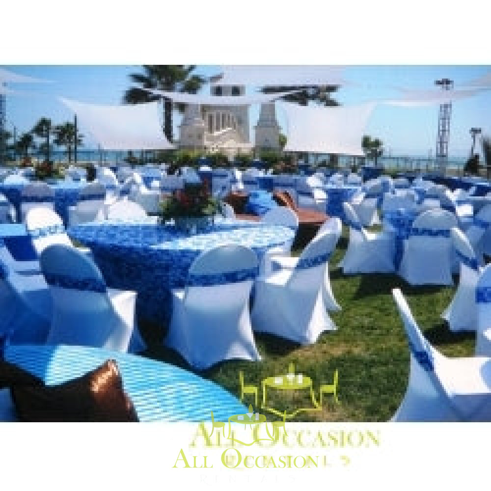 Elegant outdoor event setup with blue and white chairs and tables, ideal for Corona party rentals and event decor.