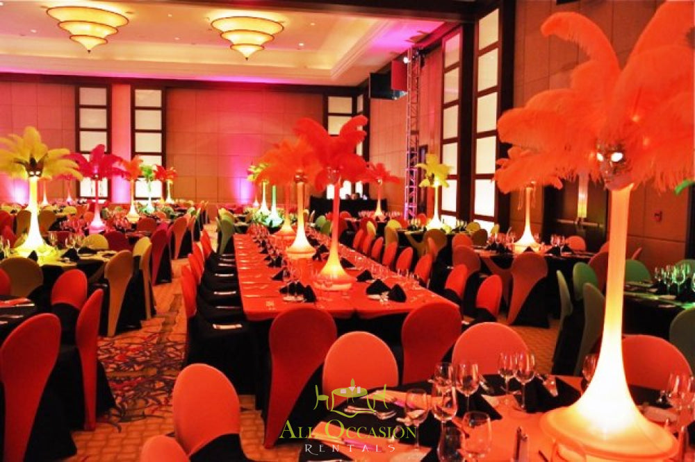 Colorful feather centerpieces for event rentals in Corona, perfect for wedding and party décor with banquet tables and chairs.