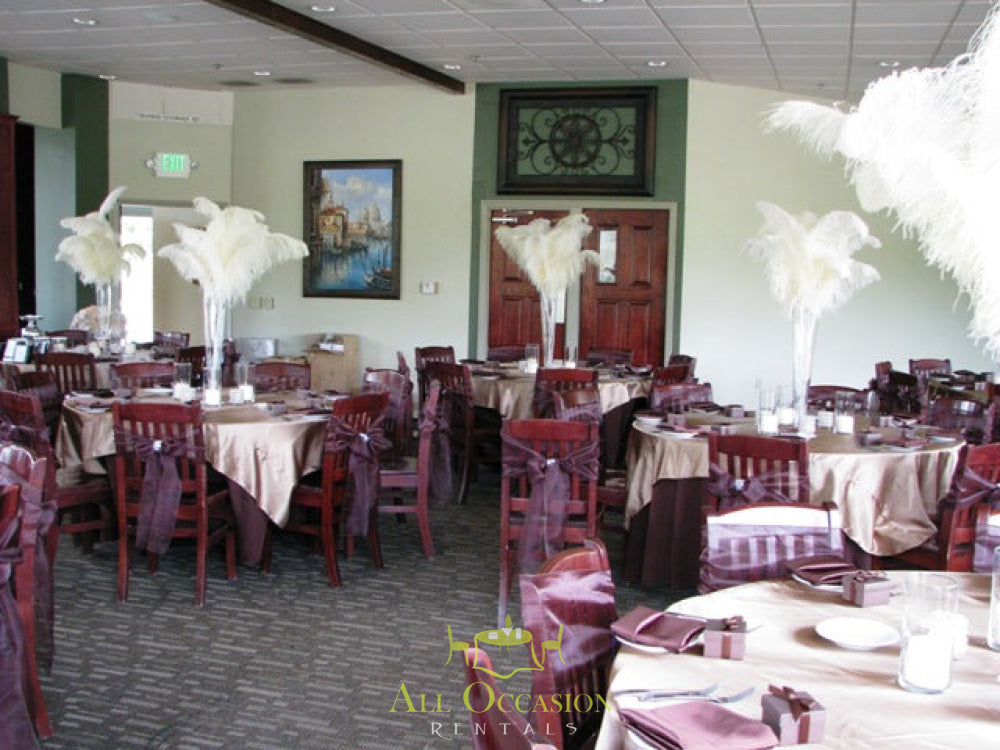 Elegant feathers centerpieces for event rentals in Corona, enhancing banquet tables and chair rentals.