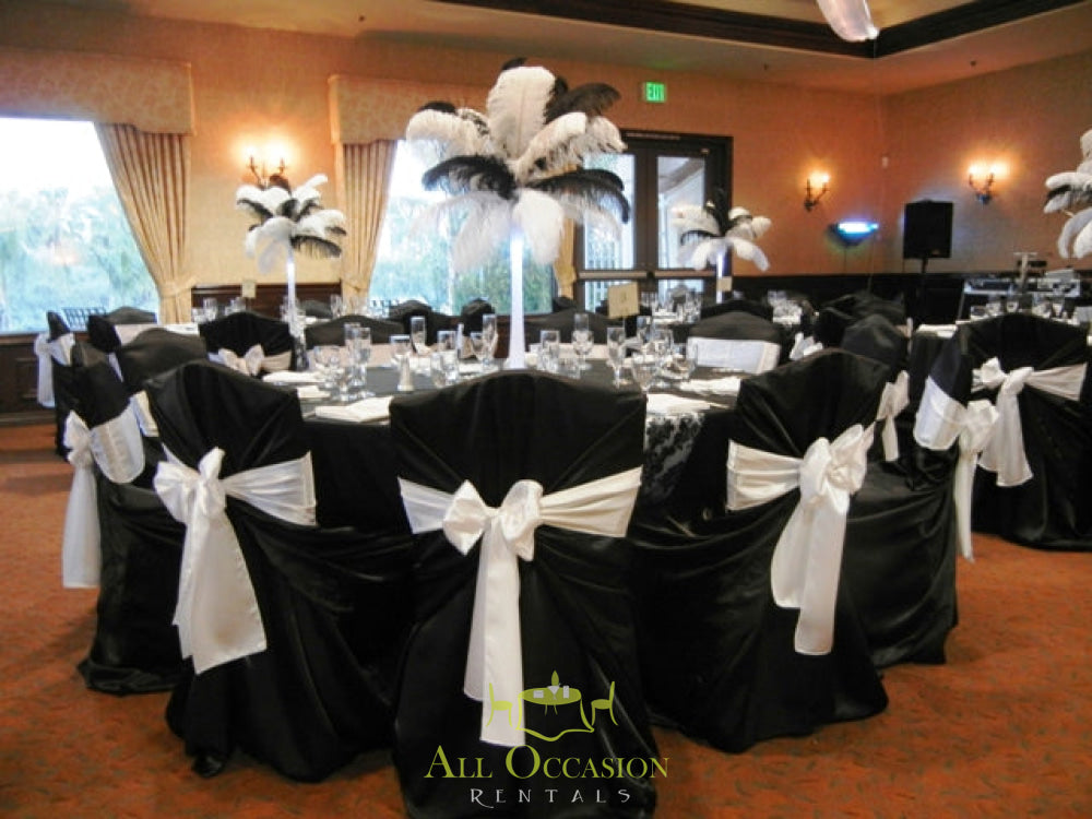 Elegant Feathers Centerpieces in a banquet hall for event rentals in Corona CA, featuring black and white decor.