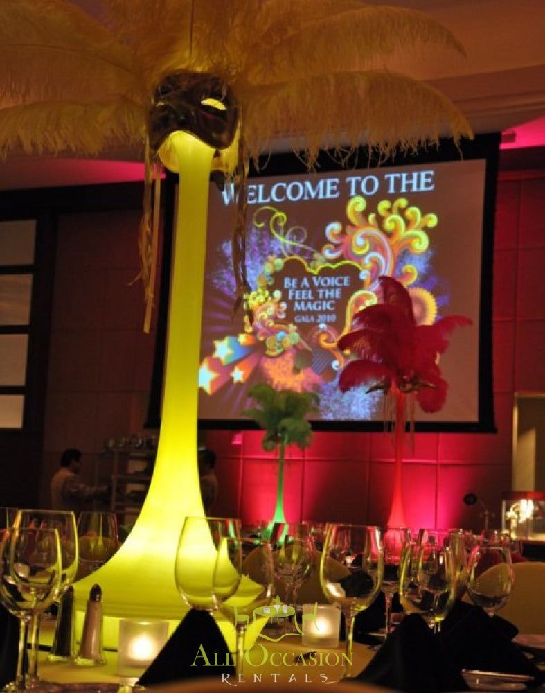 Elegant feather centerpieces for Corona event rentals, perfect for 70s party decor and wedding celebrations.