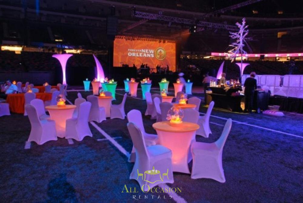 Elegant event setup featuring illuminated tables and chairs for rental in Corona, ideal for parties and receptions.