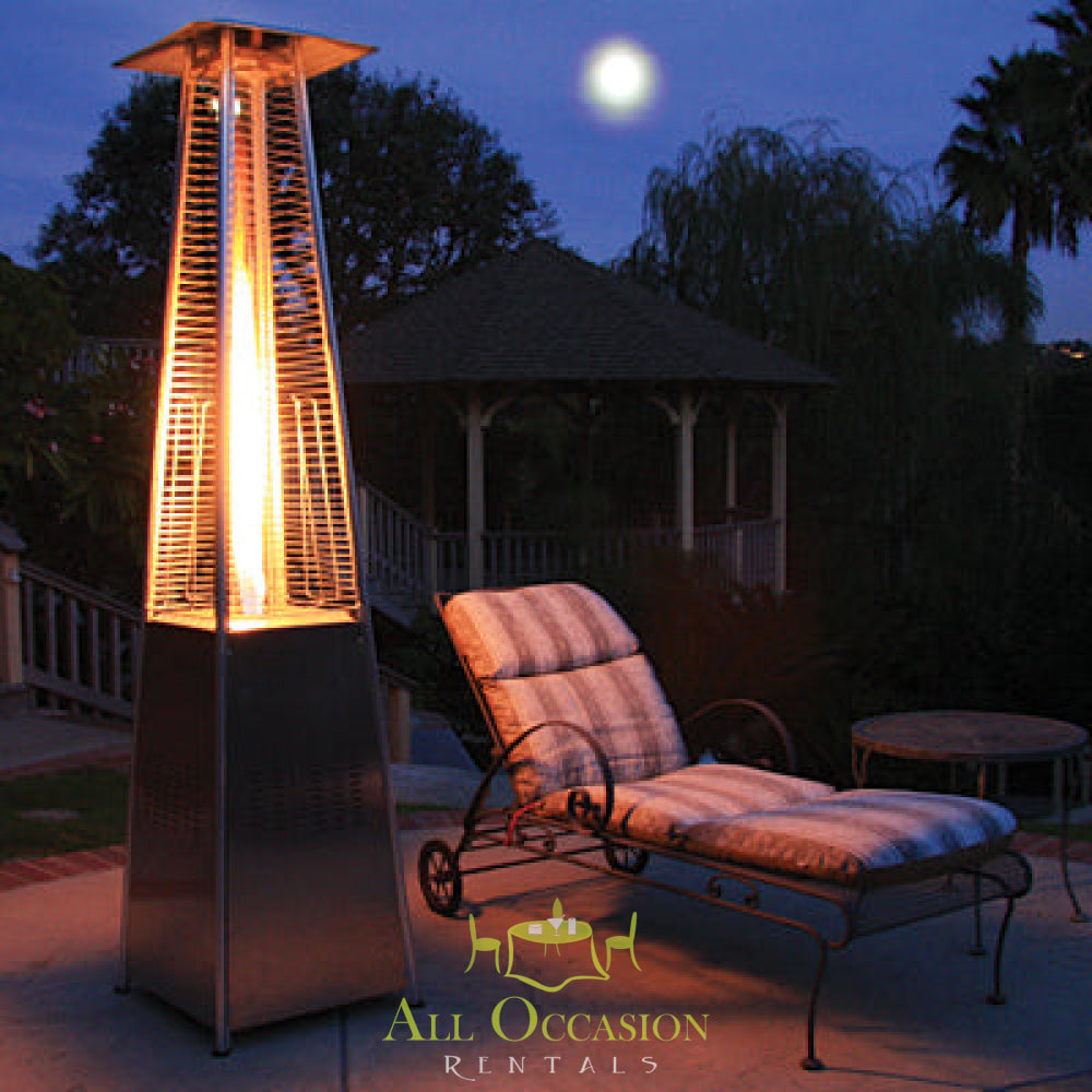 Stylish Glass Tube Propane Patio Heater lit at night, perfect for outdoor event and party rentals in Corona.