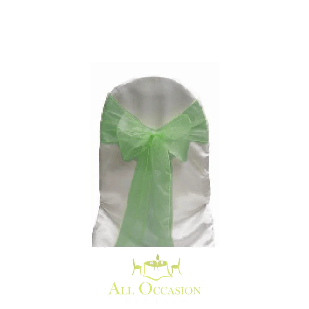 Forest green organza sash on a white chair for event decor, perfect for Corona party rentals or wedding rentals.