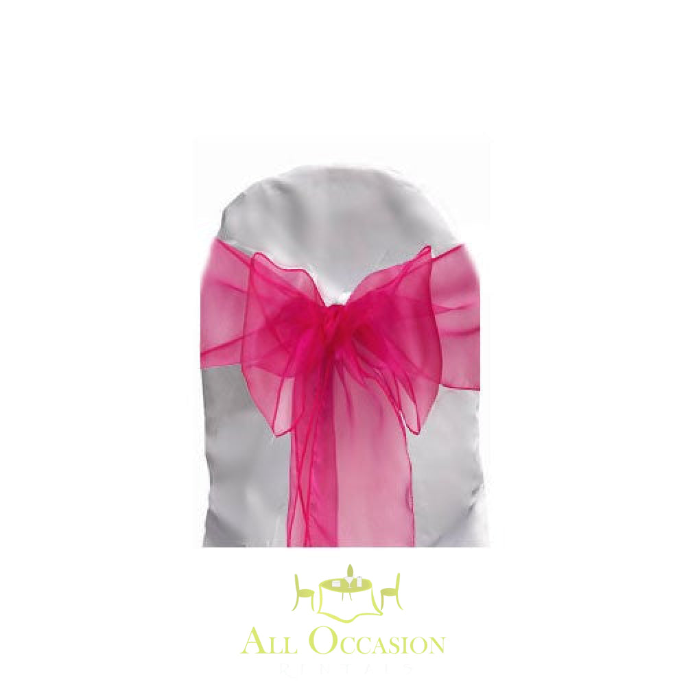 Fuchsia organza sash on a white chair cover, perfect for Corona event rentals and weddings.