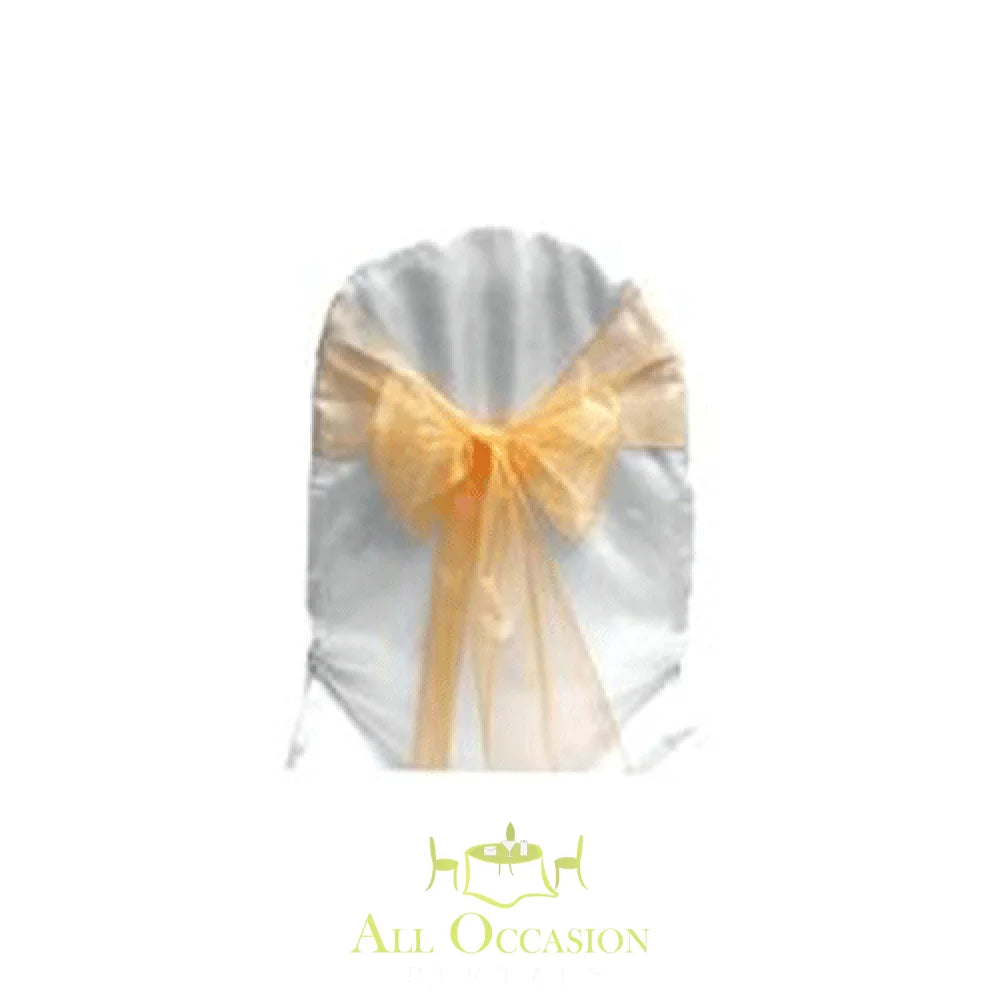 Peach organza sash on a white chair cover for event rentals in Corona, perfect for weddings and special occasions.