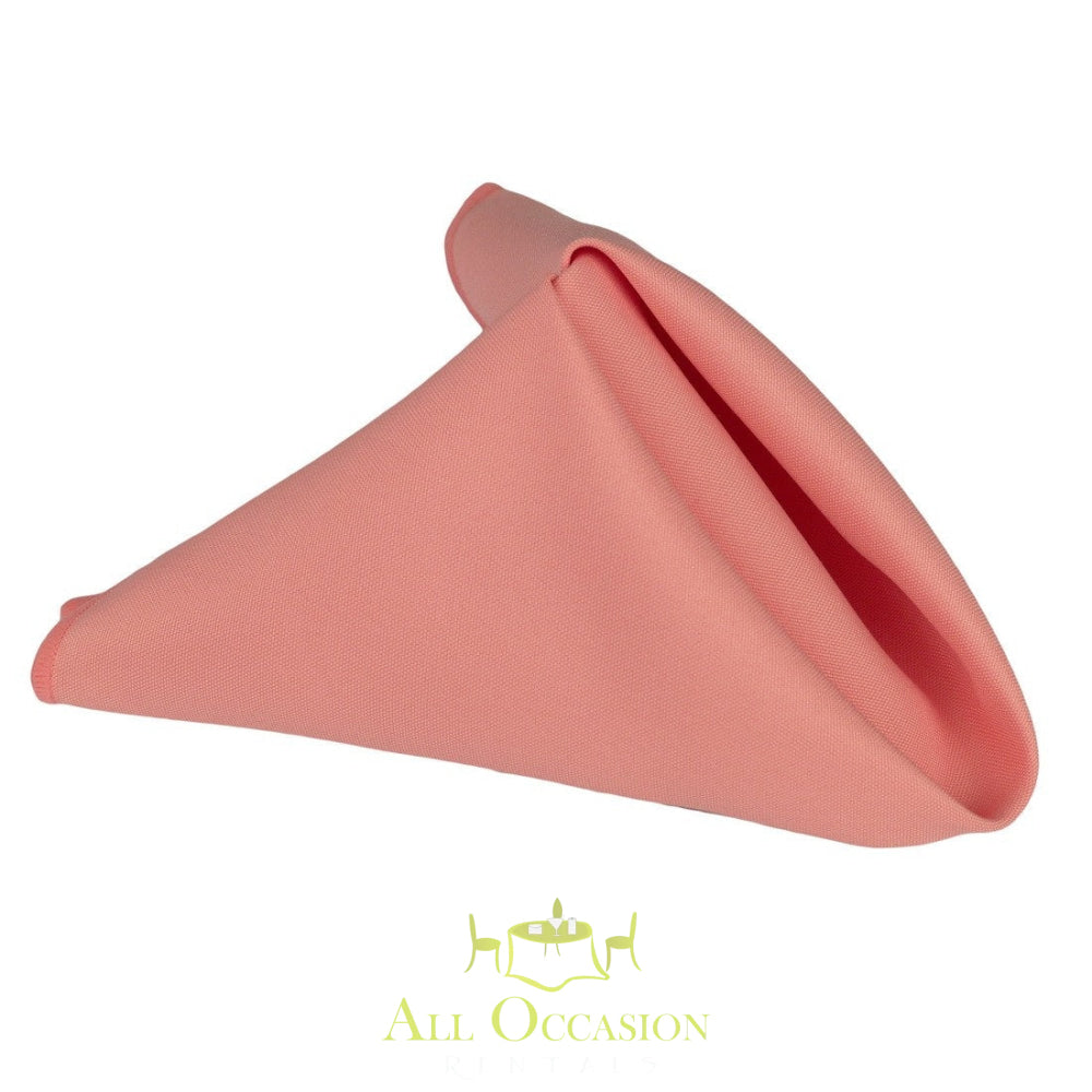 Peach polyester napkin for elegant table settings at Corona event rentals and wedding occasions.