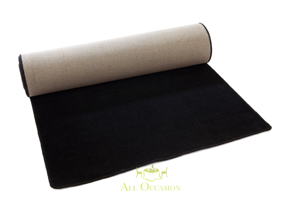 Black carpet runner perfect for event rentals in Corona, enhancing ambiance for parties and special occasions.