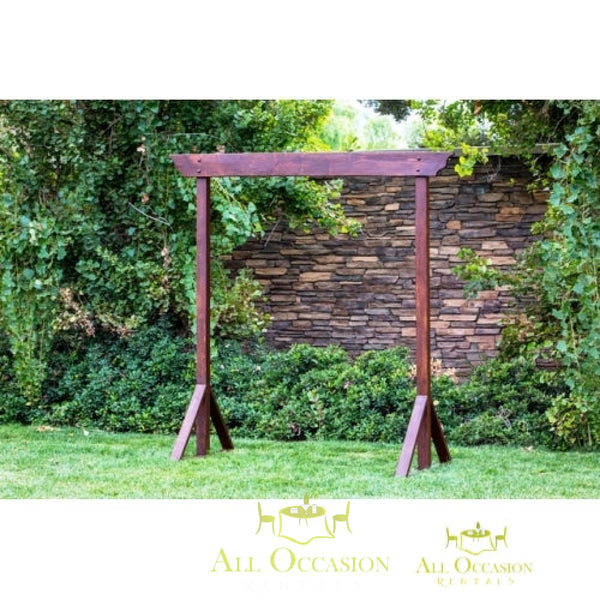 Rustic wood wedding arch rental for special events in Corona. Ideal for wedding ceremonies or outdoor decorations.