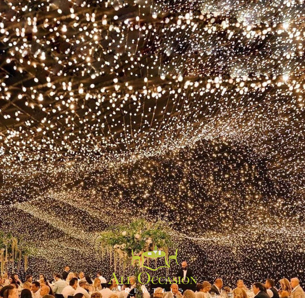 Stunning twinkle lights illuminating a wedding reception, ideal for Corona event rentals and party decorations.