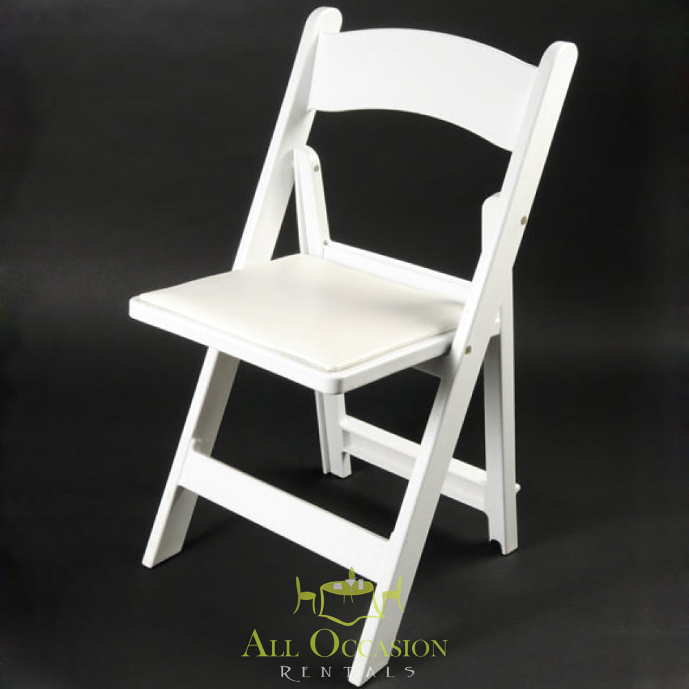White resin folding chair with padded seat for event rentals in Corona, ideal for weddings and banquet seating.