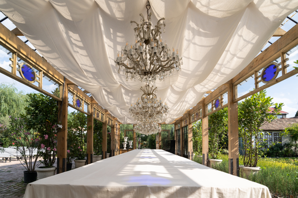 Draped tent ceiling with chandeliers