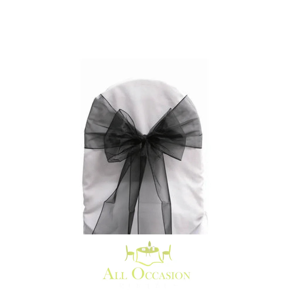 Black organza sash on banquet chair for event rentals in Corona, enhancing wedding decor and party aesthetics.