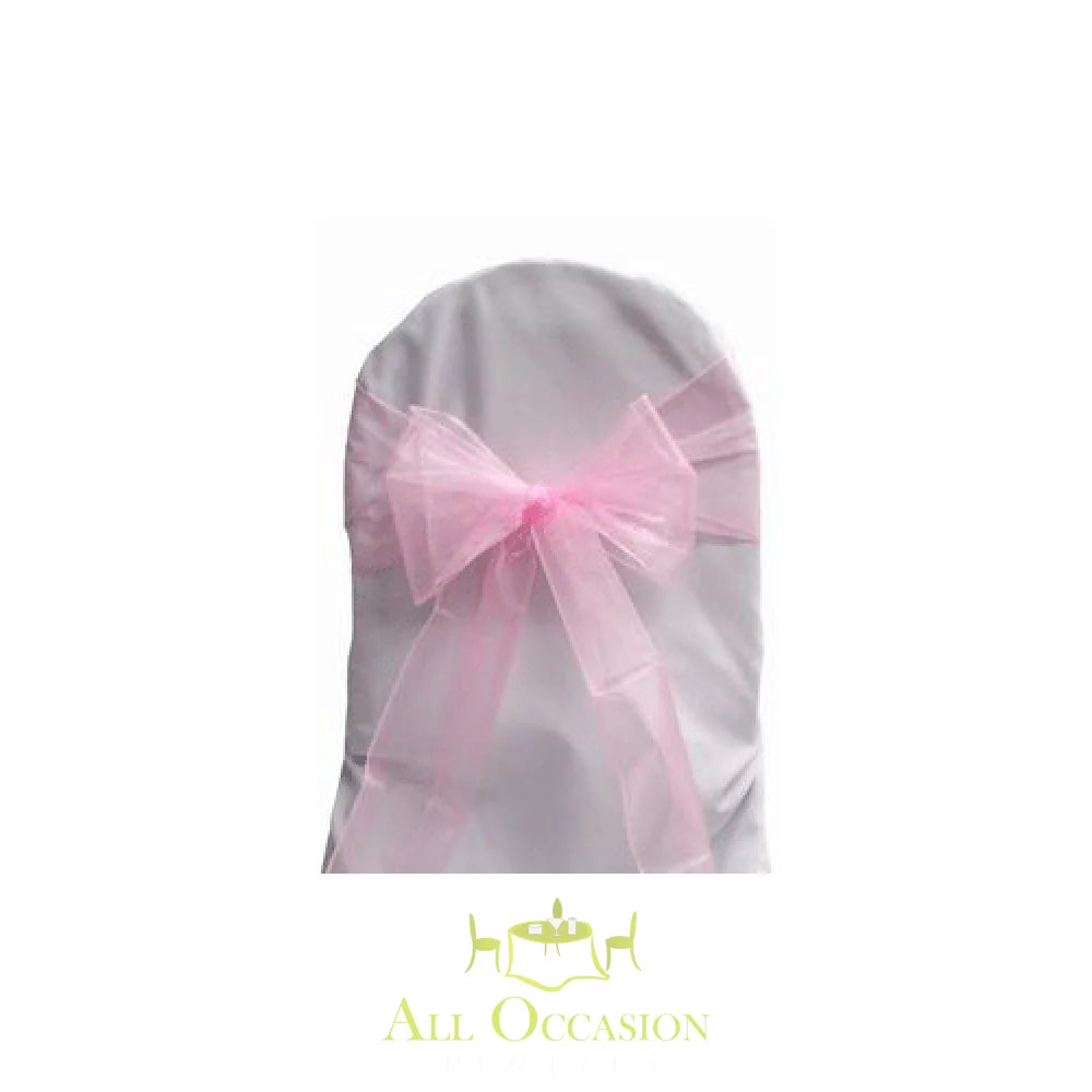 Pink organza sash tied on a chair, perfect for weddings and events with Corona party rentals.
