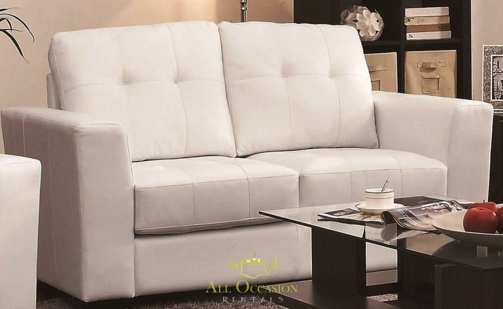 White leather loveseat for event rentals, perfect for weddings and parties in Corona, CA.